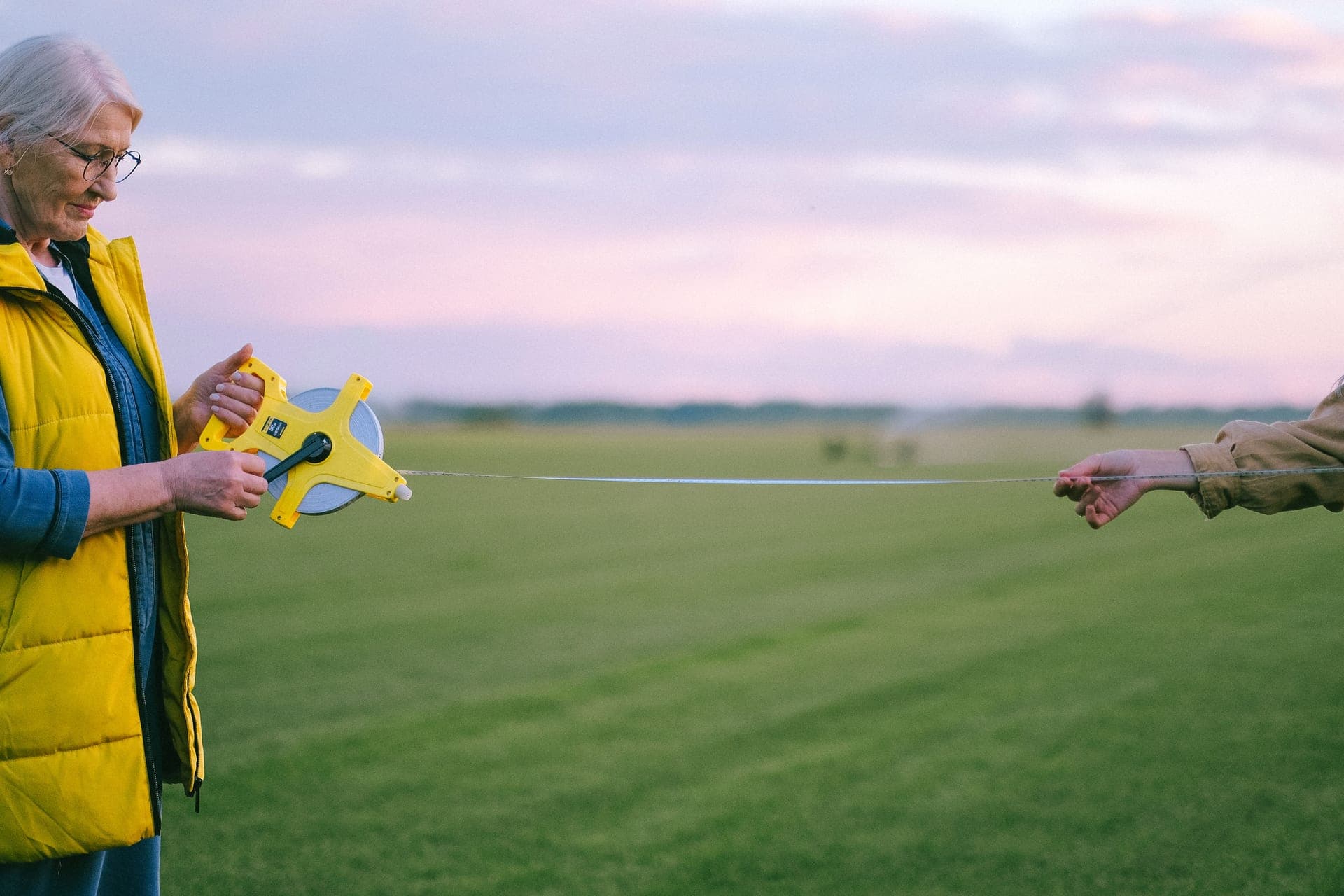 A measuring tape laid out on grass