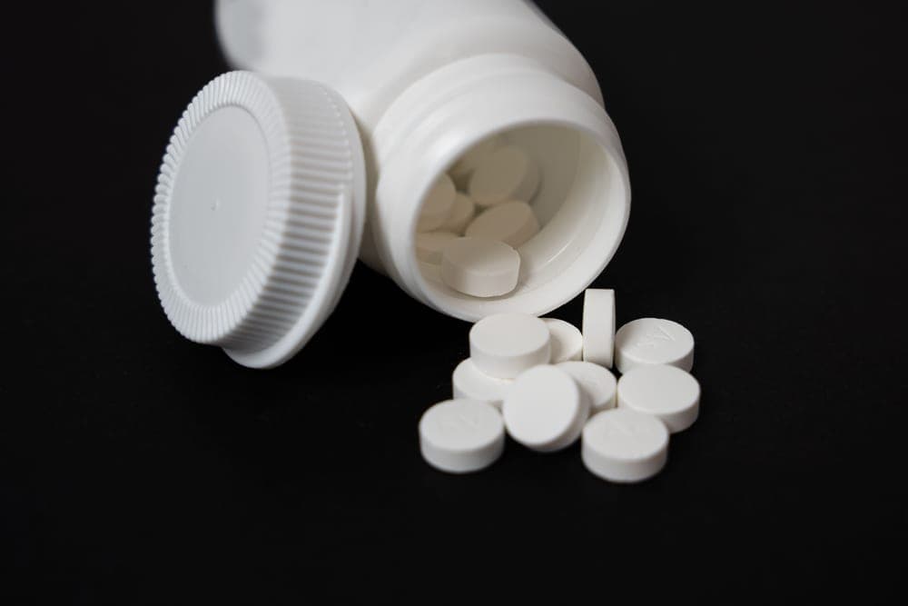 White chlorine tablets in a container