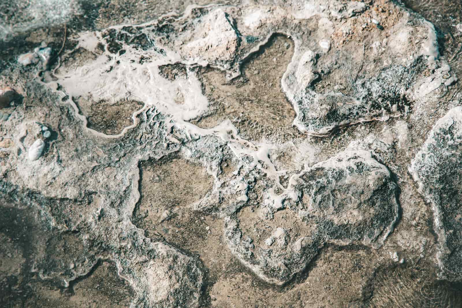 White limescale deposits built up around a tap