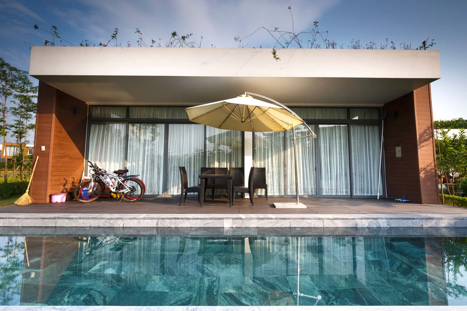 A large modern swimming pool at a contemporary house