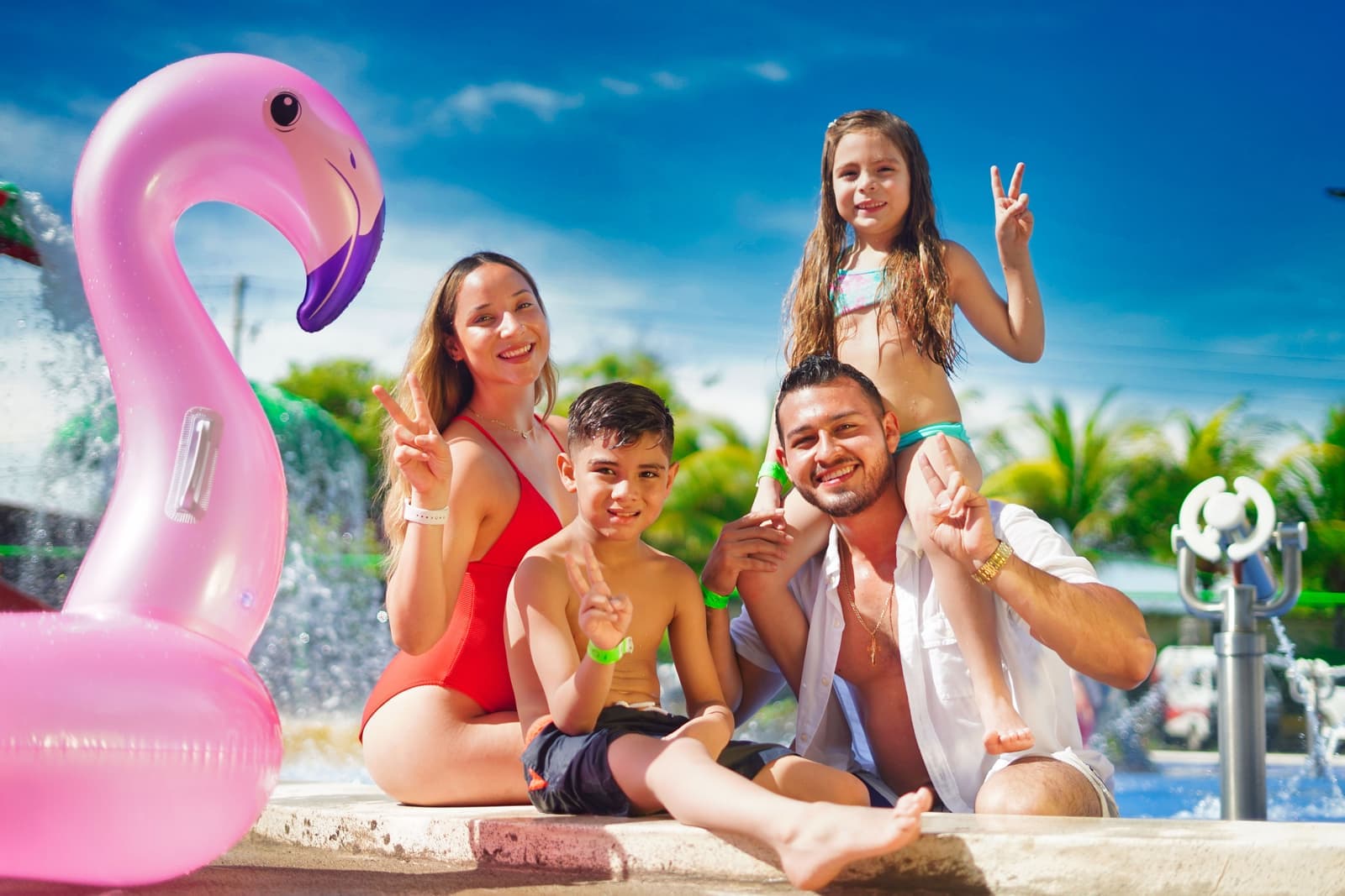 A family enjoying a swimming pool together