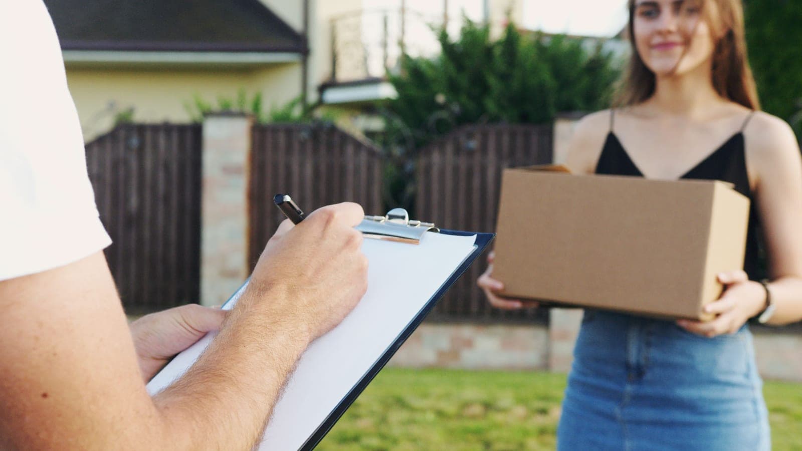 A parcel being handed over on delivery