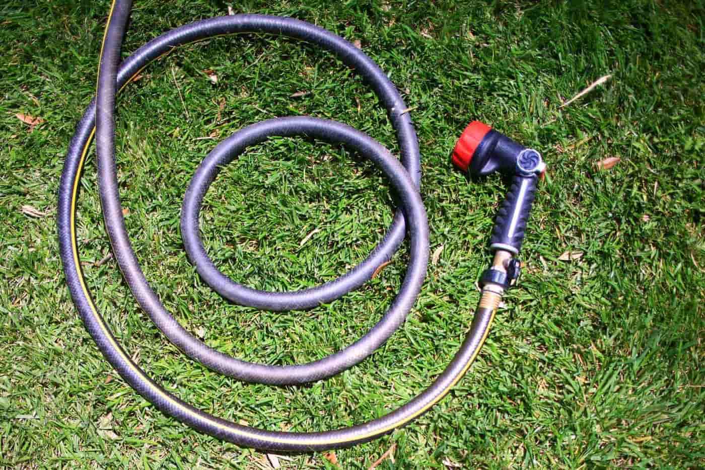 A coiled hose with fittings laid out