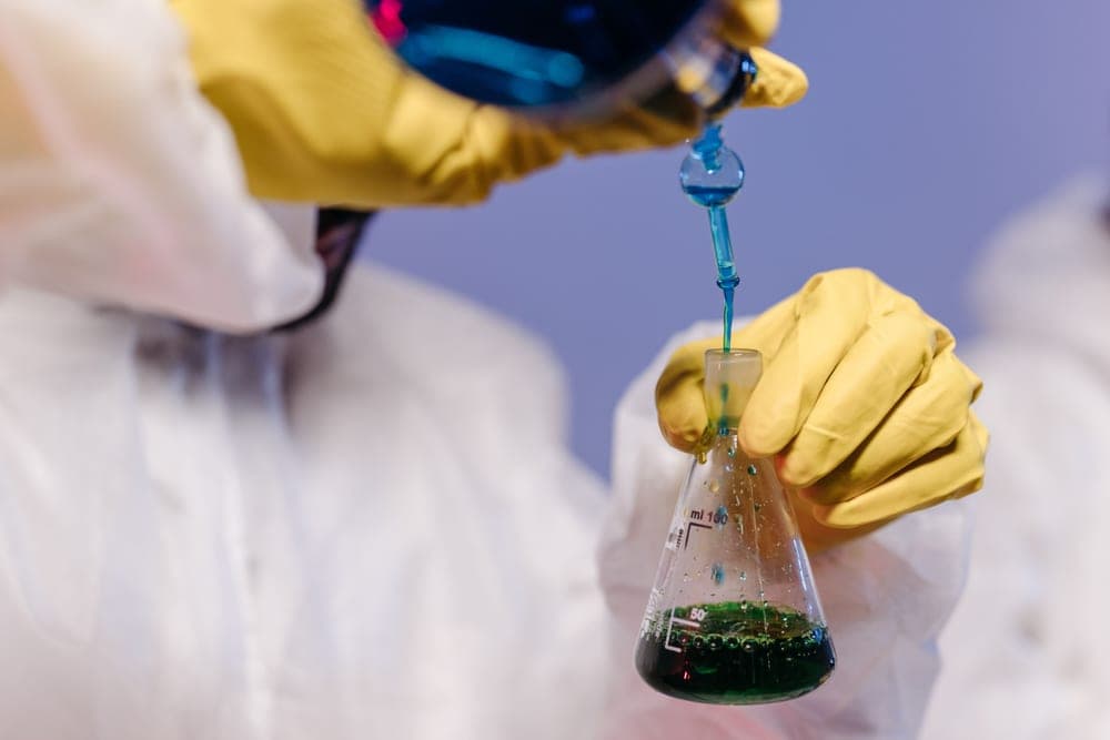 A pH meter being used to test water in a laboratory setting
