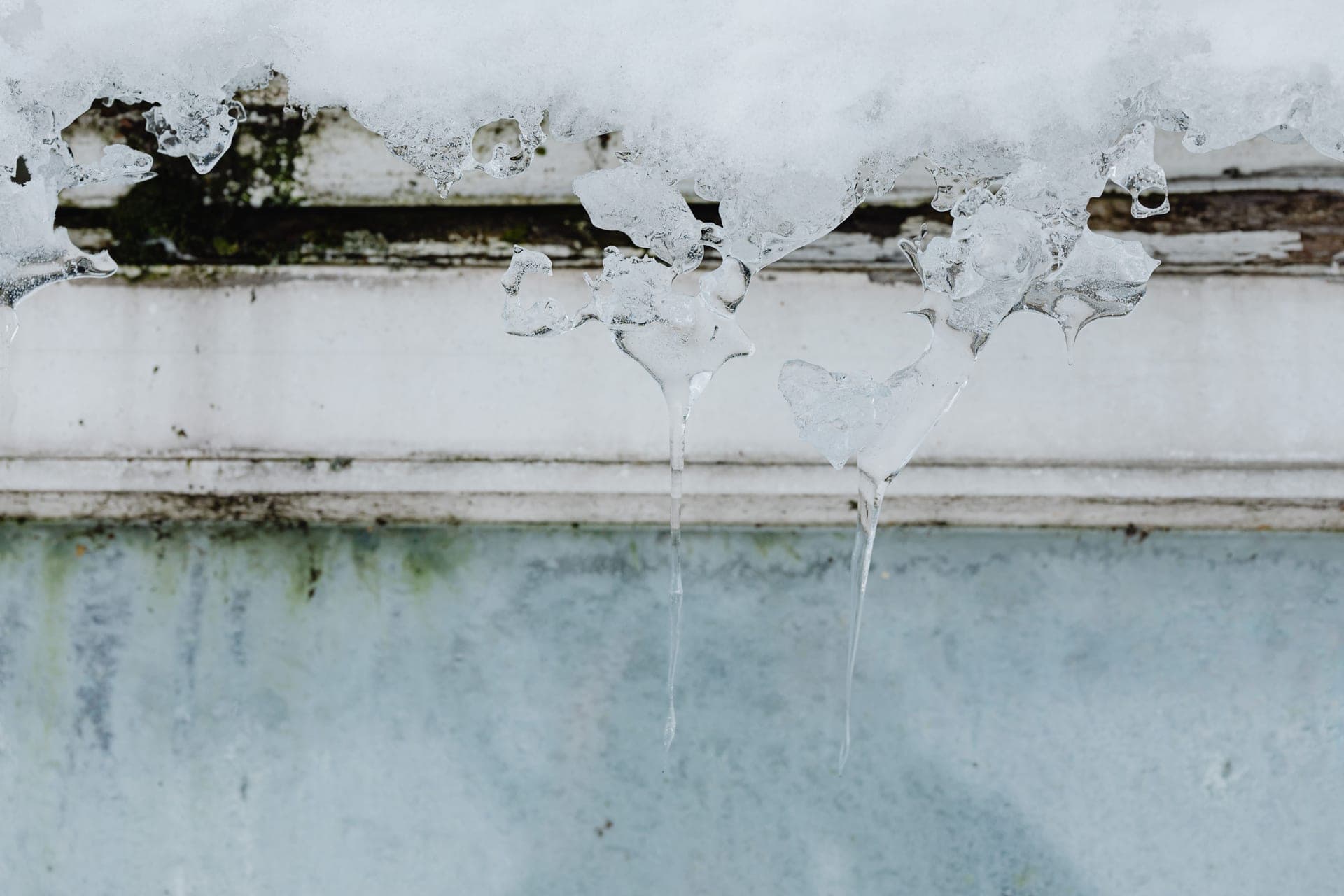 Icicles hanging from a building in winter