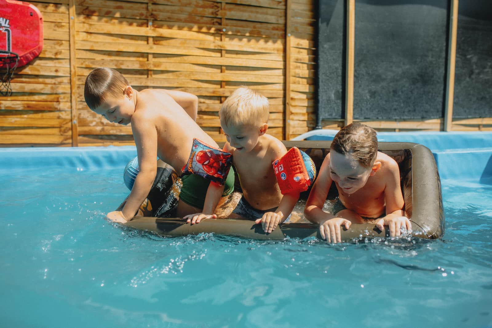 Children playing games in a swimming pool