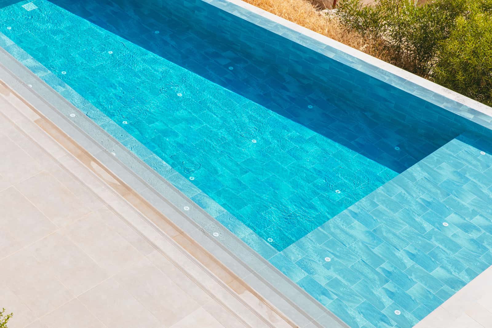 A rectangular swimming pool photographed from above