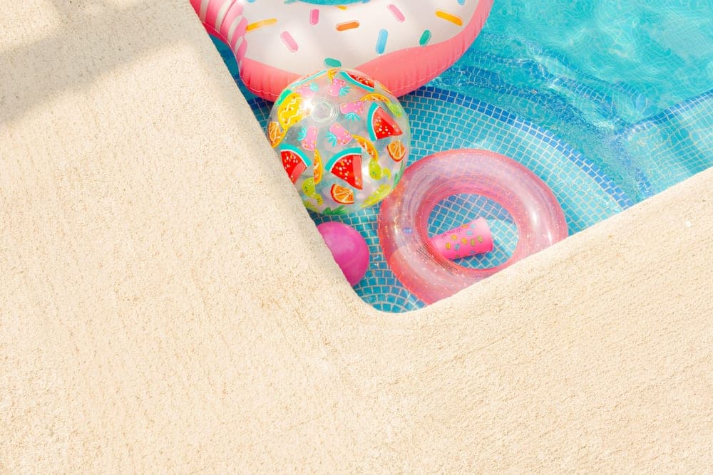 A colorful beach ball and pool toys