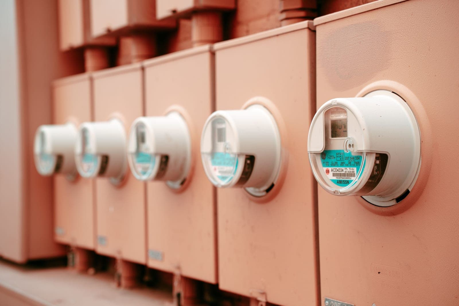 A residential electricity meter on the outside of a house