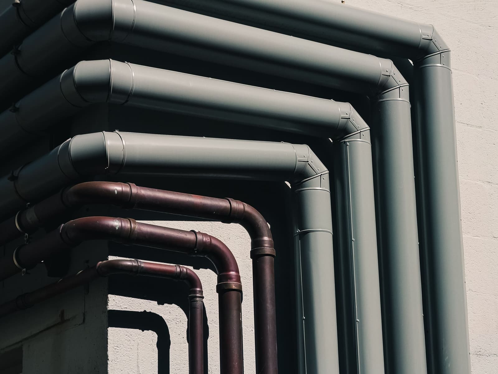 Pool pipework and plumbing beside a swimming pool