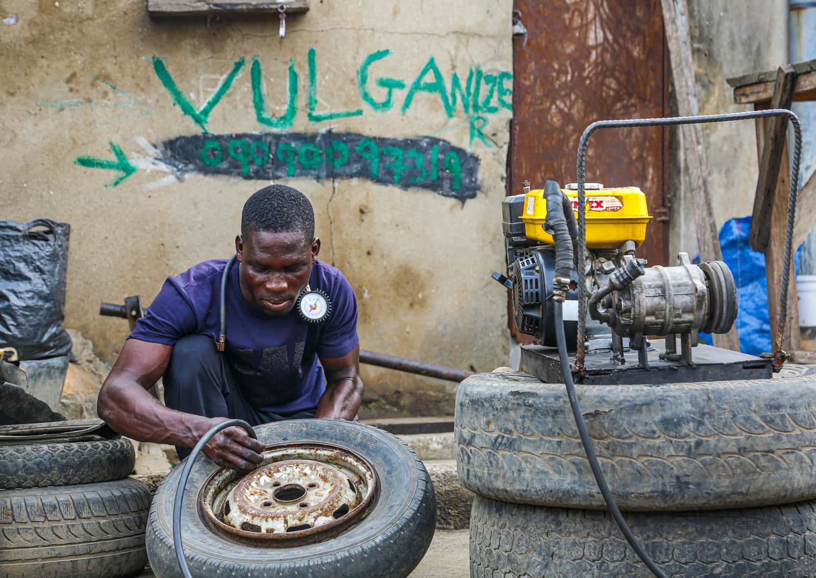 A person working on a water pump unit