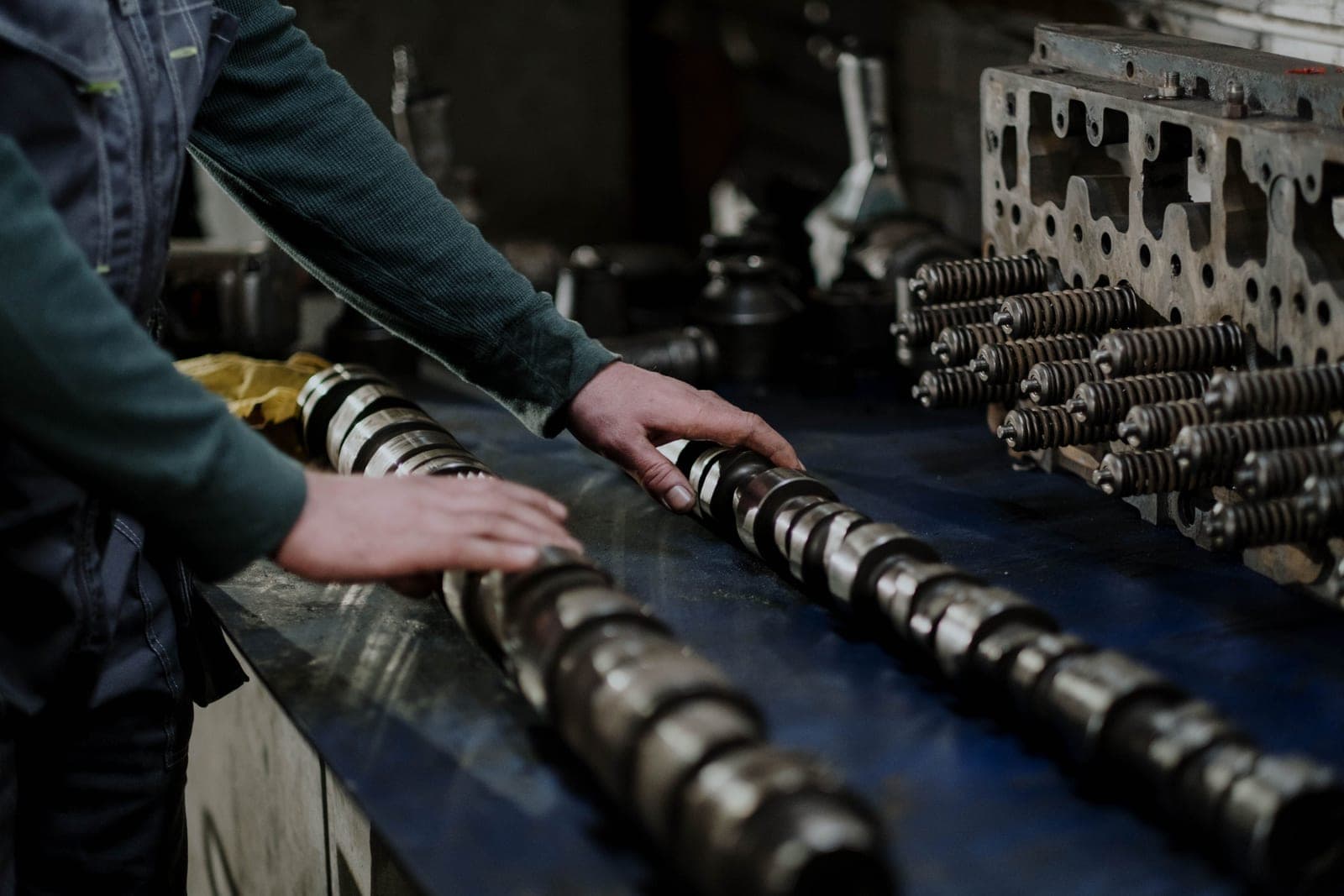 Spare parts and hand tools laid out on a workbench