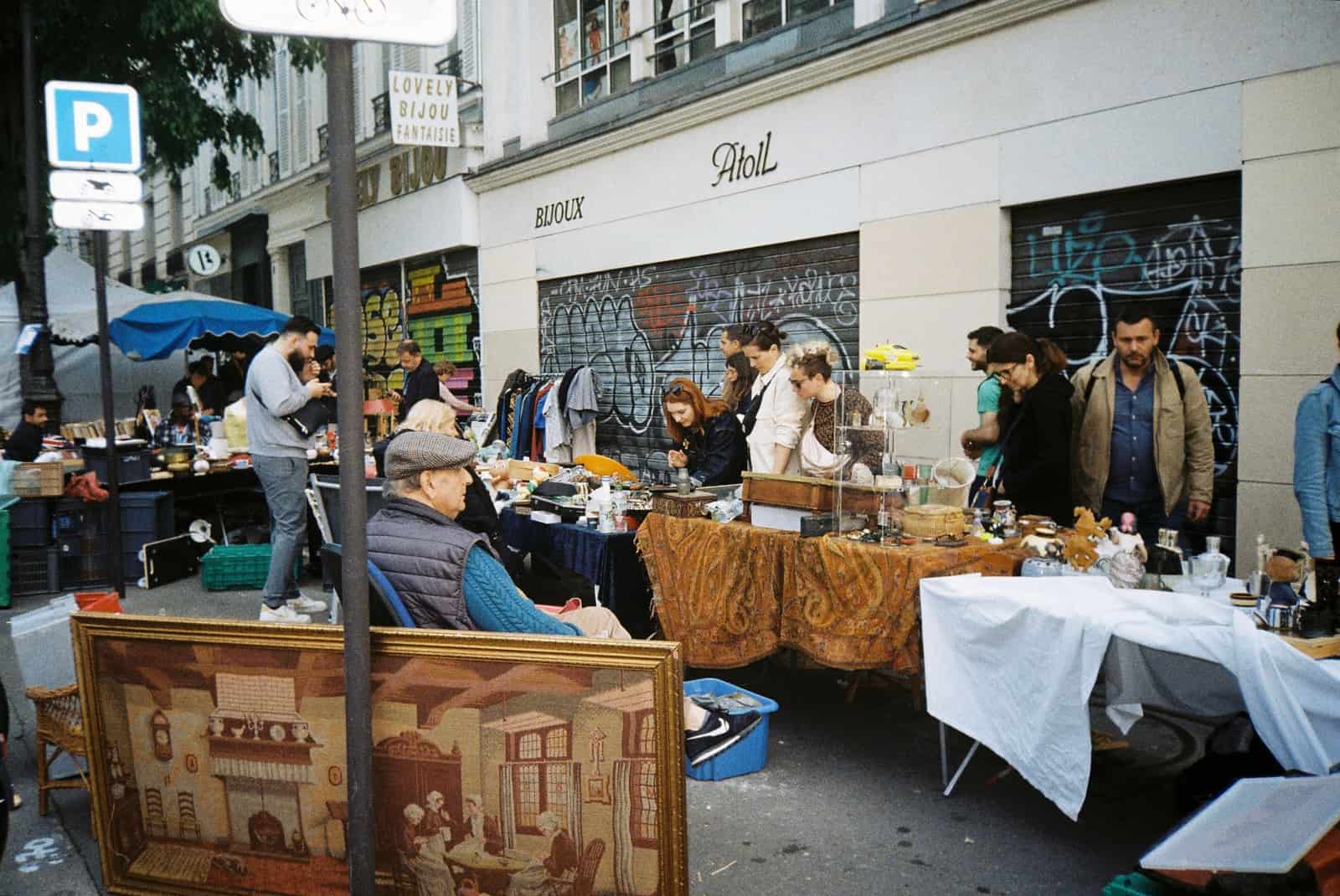 Second-hand goods laid out at an outdoor market stall