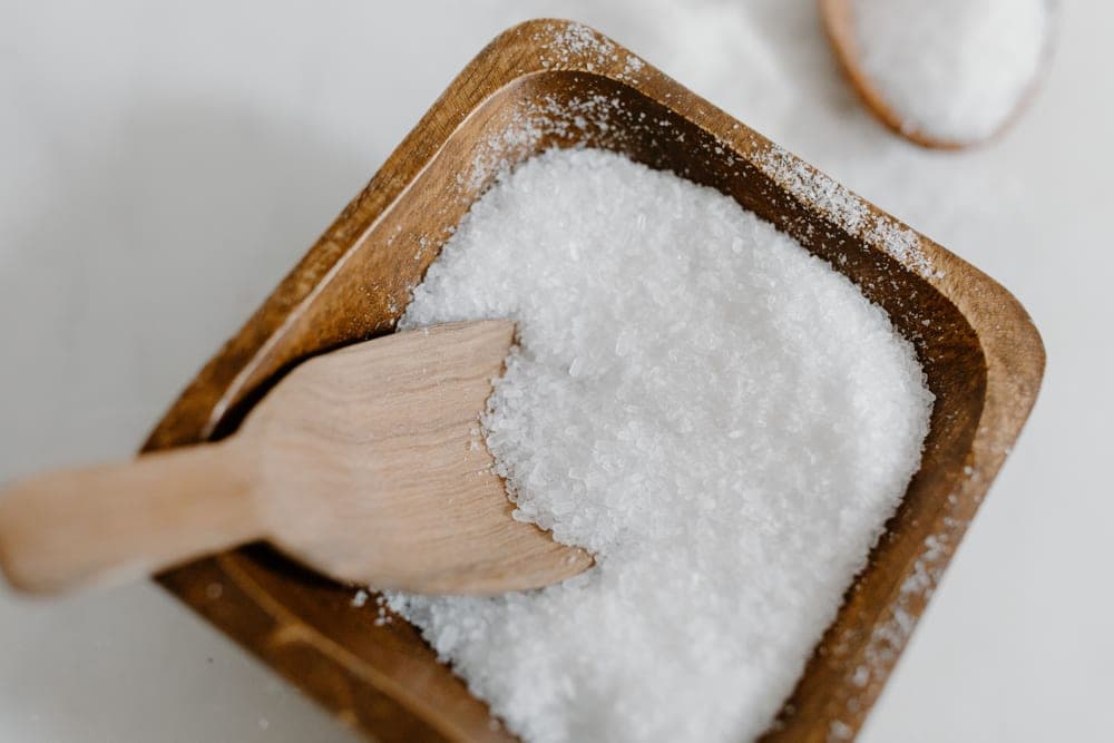 Coarse salt crystals in a shallow bowl