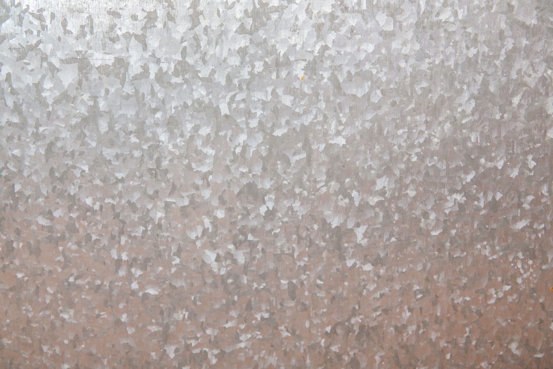Close-up of a rough galvanized steel surface