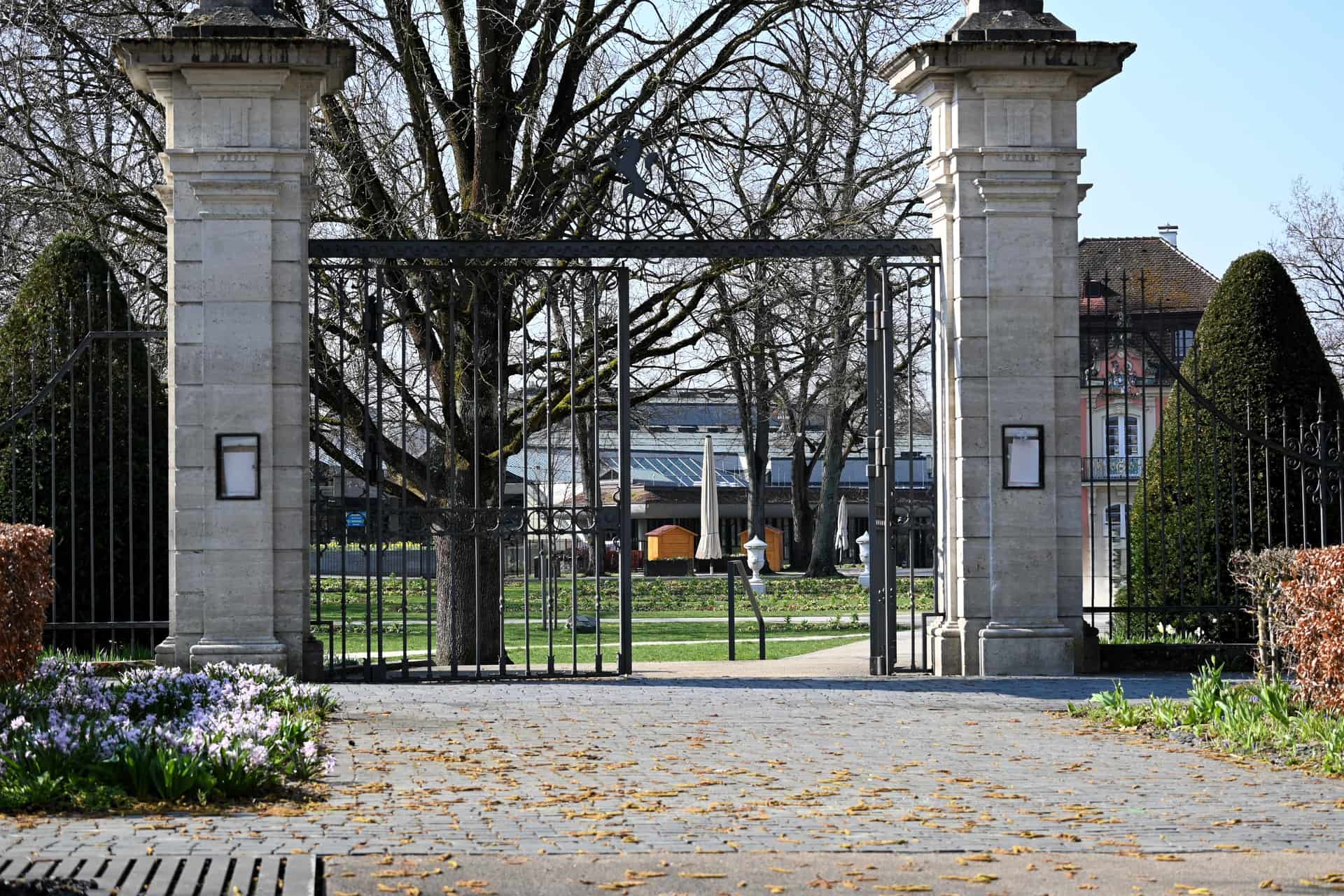 A narrow gate leading to a garden path