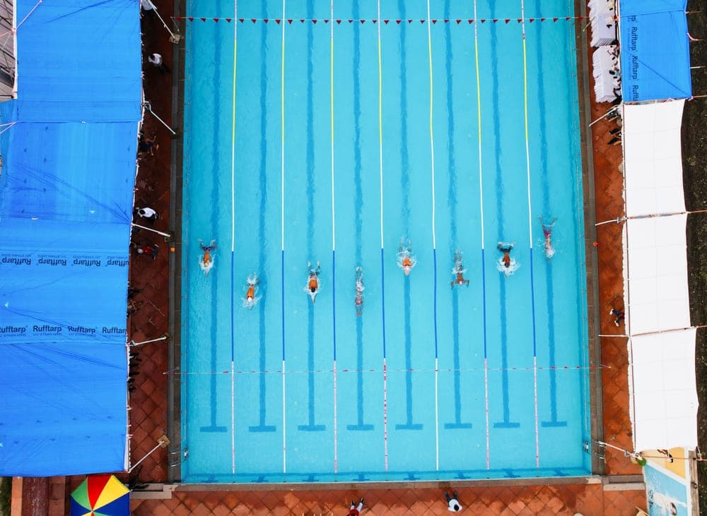 An aerial view of swimming pools of different shapes