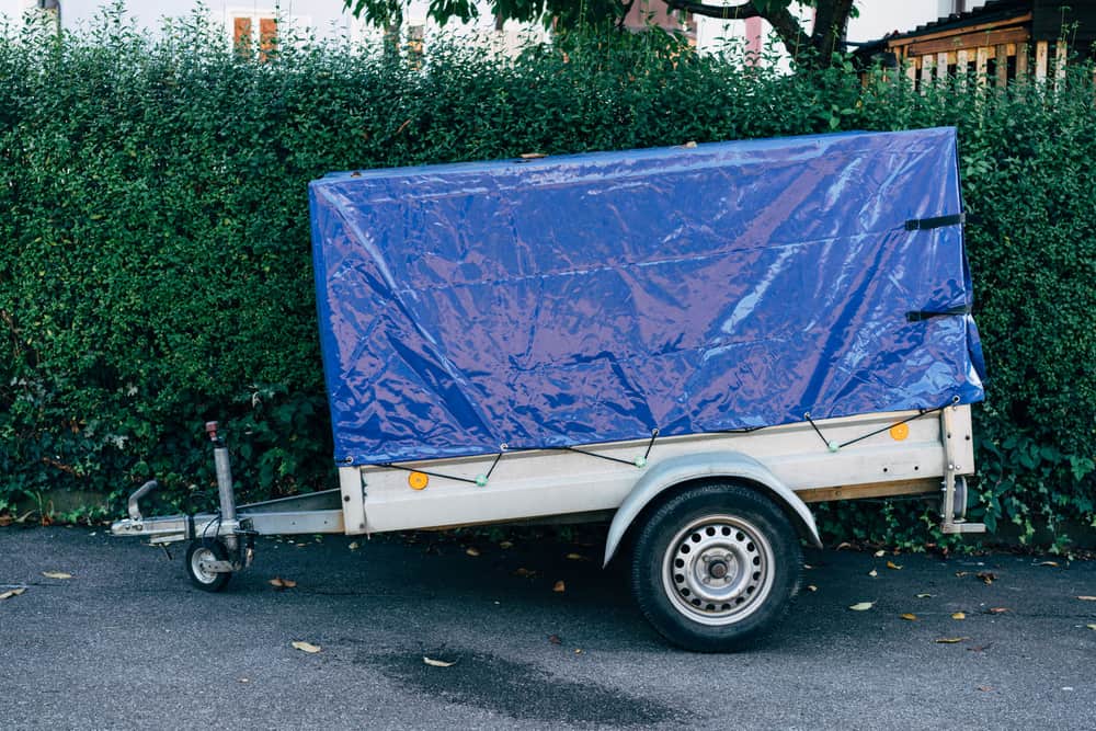 A heavy blue tarpaulin cover sheet
